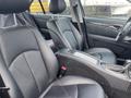 Interior view of a 2007 Mercedes-Benz E-Class showing black leather front seats and a center console with controls