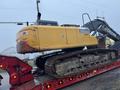 A yellow 2014 John Deere 350G excavator with a substantial crawler track and operational cab positioned on a red flatbed trailer