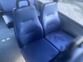 Two blue patterned seats in a 2017 Chevrolet Express interior