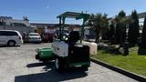 A 2017 Laymor SweepMaster 300 is parked with a green and white body featuring a seat and sweeping equipment attached to the front