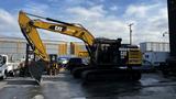 A 2018 Cat 326F Track excavator with a yellow and black exterior featuring a large digging arm and bucket