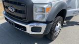 A 2011 Ford F-450 Super Duty truck with a chrome front grille and large tires