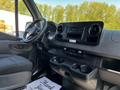 Interior view of a 2022 Mercedes-Benz Sprinter showing the dashboard controls seating area and a floor mat with a thank you message