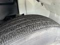 Close-up of a tire from a 2007 International 4200 displaying tread pattern and surface details