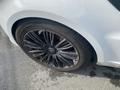 A close-up of a black alloy wheel with a large tire on a 2020 Land Rover Range Rover Sport