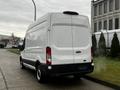 A white 2021 Ford Transit van positioned at an angle showing its rear and side view with a smooth exterior and no visible markings