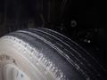 A close-up of a tire from a 2003 Toyota Toyoace showing tread patterns and sidewall detail