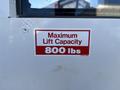 A label affixed to a white vehicle indicating a maximum lift capacity of 800 lbs