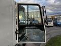A 2007 Tennant Sentinel with an open door revealing the interior details and control panel of the machine