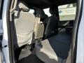Interior view of a 2017 Ford F-150 showing the back seats with gray upholstery and a spacious seating area