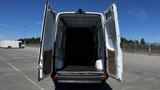 White 2016 Mercedes-Benz Sprinter van with open double doors showcasing an empty cargo space inside