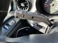 Close-up of the turn signal and windshield wiper control lever inside a 2021 Mercedes-Benz Sprinter cabin