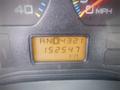 Dashboard display of a 2006 International 4300 showing the gear shift in RND4321 and odometer reading 152547 km