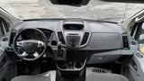 Interior view of a 2017 Ford Transit van showcasing the dashboard steering wheel and control panel with various buttons and displays