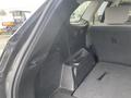 Interior view of a 2017 Hyundai Santa Fe with the rear seats folded down showing a spacious cargo area and black upholstery