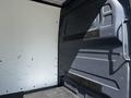 Interior view of a 2022 Mercedes-Benz Sprinter cargo van with a clean, spacious load area and a textured floor