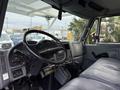 Interior view of a 2007 International 4200 showing the driver's seat steering wheel and dashboard controls