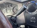 Interior view of a 2010 Ford F-550 dashboard showing the gear shift lever and various control dials