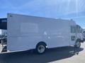 A 2007 Freightliner MT55 box truck with a white exterior and a large cargo area on the side