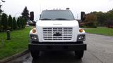 A white 2008 Chevrolet C7500 front view with a horizontal grille headlights and side mirrors positioned at the front