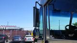 A 2005 Morgan Olson Workhorse delivery truck with a large windshield and side mirror visible in the foreground