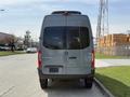 A 2019 Mercedes-Benz Sprinter van viewed from the rear with a gray exterior and the brand logo displayed prominently on the back door