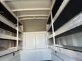 Interior of a 2019 Ford F-350 SD featuring metal shelves on both sides for storage purposes