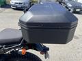 A black top box mounted on the rear of a 2022 Royal Enfield Himalayan motorcycle