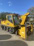 A yellow 2008 Camoplast SW 4S snowblower featuring a cab and tracked wheels with a large snow throwing chute at the front