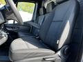 Interior view of a 2021 Mercedes-Benz Sprinter showing the driver's seat and dashboard with black upholstery and controls