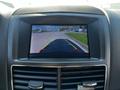 A rearview camera display showing a view behind a 2013 Lincoln MKT with guidelines for parking assistance