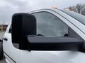 Close-up of the side mirror of a 2018 RAM 3500 pickup truck showcasing its black casing and large size designed for towing and visibility