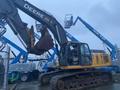 2014 John Deere 350G excavator with a yellow and gray body large bucket and tracked undercarriage