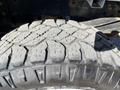 Close-up of a worn tire for a 2019 Ford F-350 SD showcasing tread patterns and rubber texture