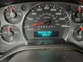 The dashboard of a 2009 GMC Savana showing the speedometer fuel gauge and engine hour meter with a reading of 4260.3