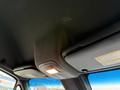 The interior ceiling of a 2019 Mercedes-Benz Sprinter featuring overhead lights and storage compartments