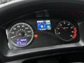 Dashboard of a 2020 Hino 338 displaying speedometer fuel gauge and digital readouts for temperature and odometer