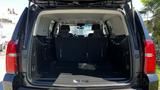 A 2018 Chevrolet Tahoe with the rear hatch open showing the spacious cargo area and two rear seats folded down