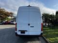 2022 Mercedes-Benz Sprinter van viewed from the rear with a white body and red taillights