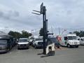 A 2004 Crown RR5210-35 forklift with extended forks positioned upright in a parking area surrounded by various vehicles