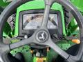 Top view of the steering wheel and dashboard of a 2003 John Deere 790 tractor showing gauges and controls