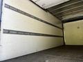 A 2020 Hino 195 box truck interior showing a clean empty cargo space with metal securing straps on the walls for load stability