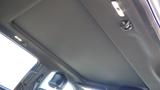 Interior view of a 2017 Ford F-350 SD focusing on the headliner and overhead features like lights and hooks