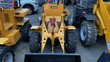 A yellow 2024 Fland FL45 compact tractor with large black wheels and a front loader attachment