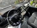 Interior view of a 2019 RAM Promaster showing the steering wheel dashboard and front seats with a modern design and various controls