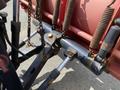 Close-up of the mounting mechanism for a 2010 Ford F-550 featuring black metal components and chains with visible wear and rust