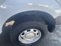 Close-up of a wheel and tire of a 2013 Ford F-150 showing the tire tread and silver wheel rim