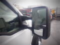 A 2008 Ford F-550 side mirror showing a reflective surface and a sturdy design