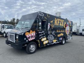 A 2011 Ford Utilimaster Food Truck with a colorful design featuring food graphics and the text KFZEE We do catering