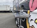 A 2011 Ford Utilimaster Food Truck with a shiny stainless steel serving counter attached to the side